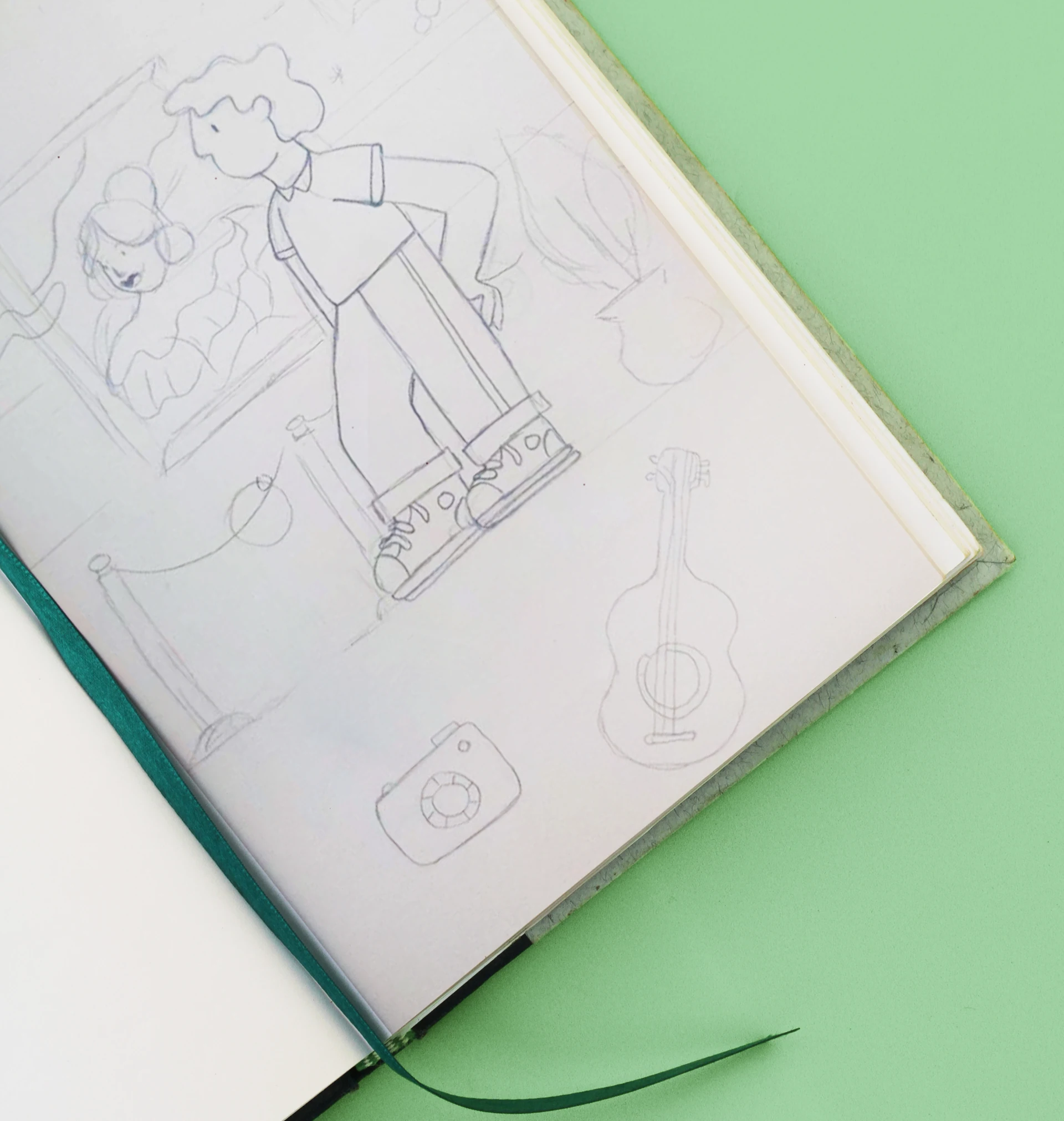Pencil sketches of Cumbayork characters in a notebook