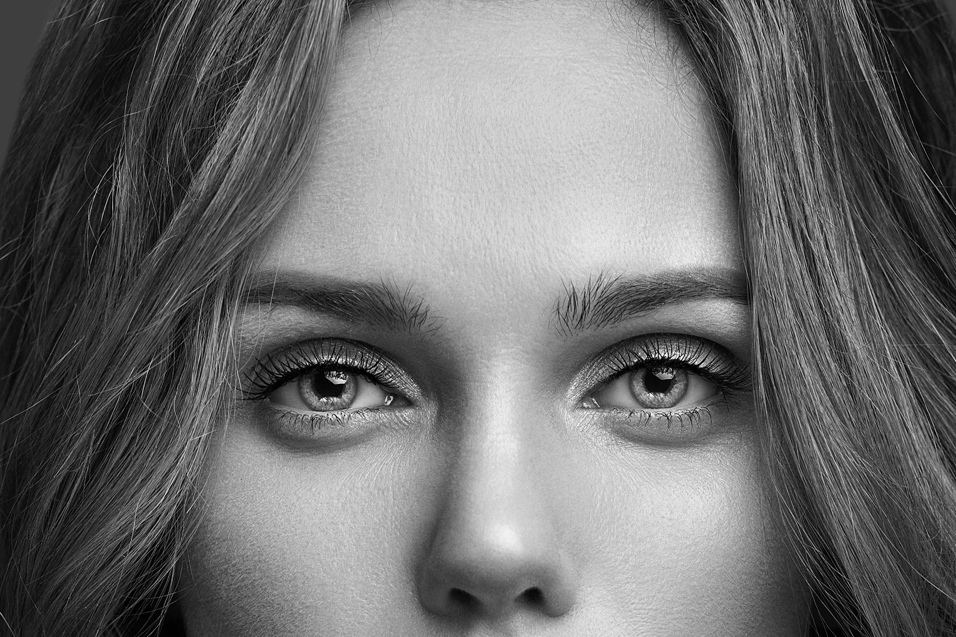 Black-and-white close-up portrait for Leulo's “beauty from within” concept
