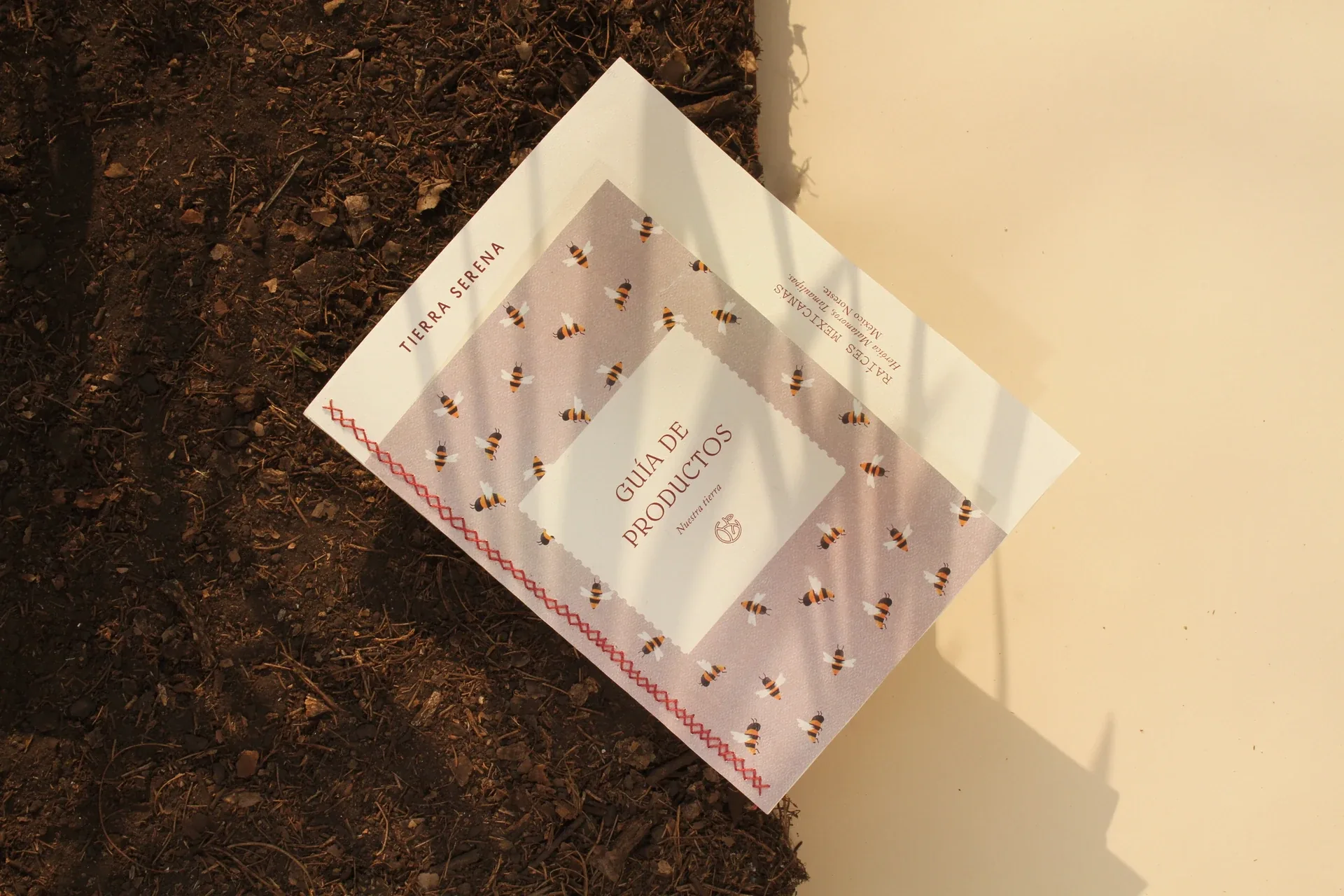 Tierra Serena booklet with bee pattern on soil