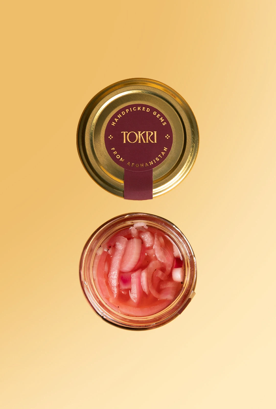 Top view of a Tokri jar lid and pickled onions