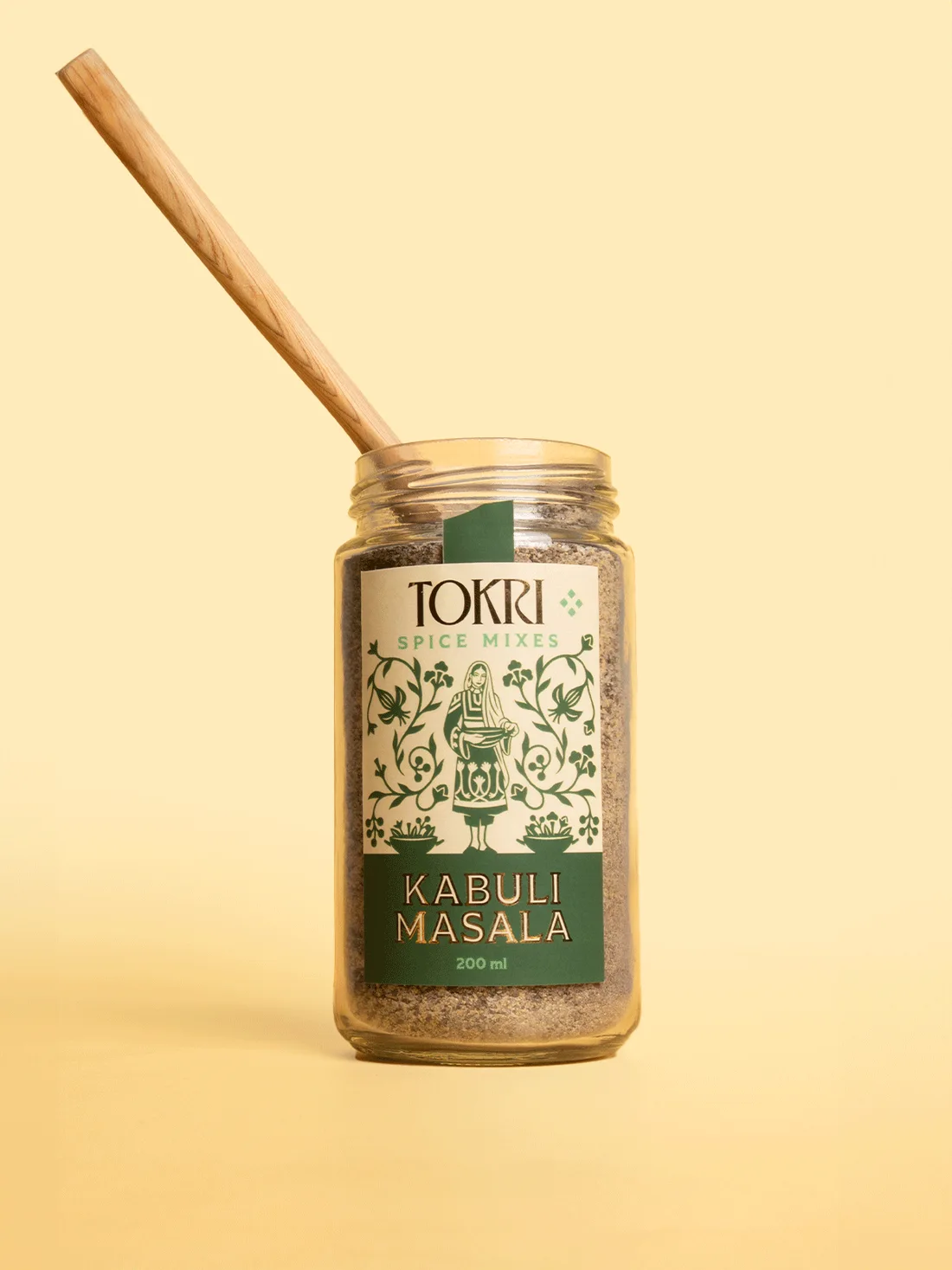 Tokri Kabuli masala spice jar with a wooden spoon